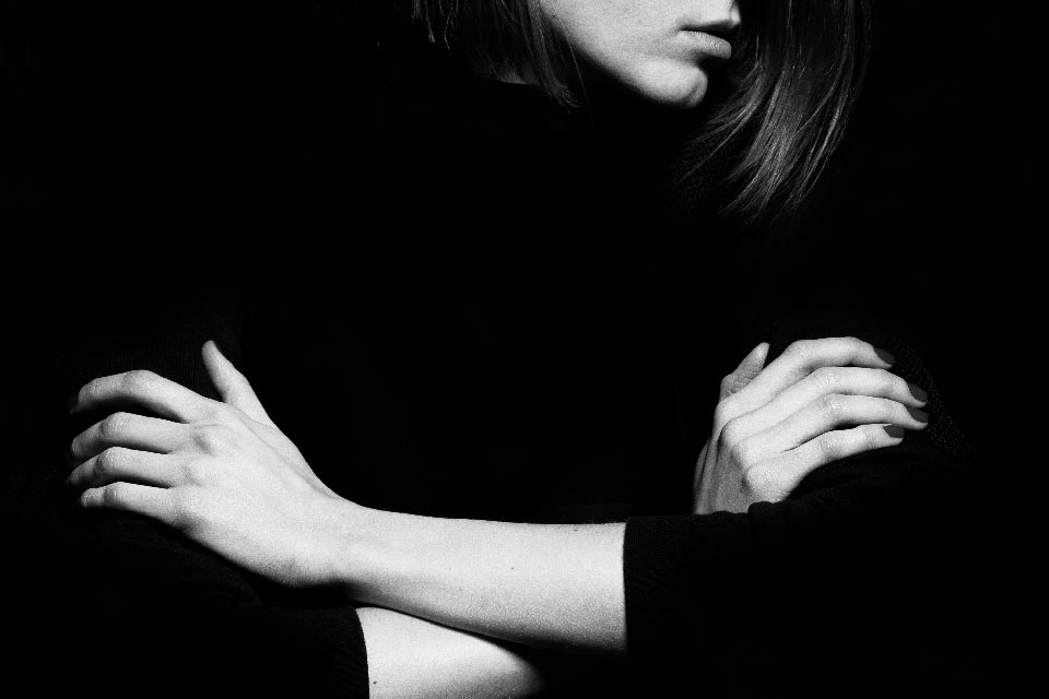 black and white photo of a woman against sexism